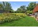 Spacious backyard with beautiful flowers and lush greenery at 3623 Doroco Dr, Atlanta, GA 30340