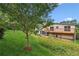 Home featuring a large deck and a vast green backyard space at 3623 Doroco Dr, Atlanta, GA 30340