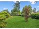 Beautiful backyard featuring lush green grass and mature trees at 3623 Doroco Dr, Atlanta, GA 30340