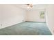Spacious bedroom with plain walls, carpet, ceiling fan, and a window at 3623 Doroco Dr, Atlanta, GA 30340