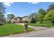 Charming two-story home with a stone facade, well-manicured lawn, and an inviting driveway at 3623 Doroco Dr, Atlanta, GA 30340