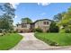 Charming two-story home featuring a stone facade, well-manicured lawn, and an inviting driveway at 3623 Doroco Dr, Atlanta, GA 30340