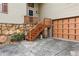 Exterior view with stone facade, wood stairs, garage door, and well-maintained landscaping at 3623 Doroco Dr, Atlanta, GA 30340