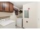Functional laundry room with washer, dryer, and storage cabinets at 3623 Doroco Dr, Atlanta, GA 30340