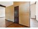 Spacious living area with wood floors, textured walls, beam ceilings, and transition to tiled area at 3623 Doroco Dr, Atlanta, GA 30340