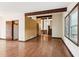 Spacious living room featuring wood floors, wooden beam accents, and plenty of natural light at 3623 Doroco Dr, Atlanta, GA 30340