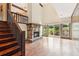 Large living room with hardwood floors, fireplace, and glass doors to the outside at 3623 Doroco Dr, Atlanta, GA 30340