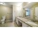 Bathroom featuring granite countertops, double sinks, and a large mirror at 5958 Tate Dr, Austell, GA 30106