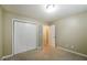 Bedroom featuring carpeted floors, closet, and an ensuite bathroom at 5958 Tate Dr, Austell, GA 30106