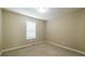 Bedroom with carpeted floors, window and neutral paint at 5958 Tate Dr, Austell, GA 30106