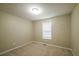 Cozy bedroom with neutral carpet, fresh paint, and a window letting in natural light at 5958 Tate Dr, Austell, GA 30106