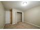Bedroom featuring carpet, a closet with folding doors, and a door leading to the hallway at 5958 Tate Dr, Austell, GA 30106