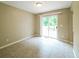 Dining area with neutral colors and a sliding glass door to the backyard at 5958 Tate Dr, Austell, GA 30106