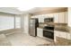 Bright kitchen with stainless steel appliances and granite countertops at 5958 Tate Dr, Austell, GA 30106