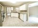 Well-lit kitchen with white cabinets, granite countertops, and stainless steel appliances at 5958 Tate Dr, Austell, GA 30106