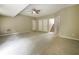 Spacious carpeted living room with multiple entryways and neutral walls at 5958 Tate Dr, Austell, GA 30106