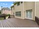 Spacious wooden deck with backyard view, leading to double doors and exterior of the home at 871 Windsor Creek Dr, Grayson, GA 30017
