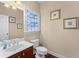 Cozy bathroom with stained glass window, vanity sink, and elegant decorations at 871 Windsor Creek Dr, Grayson, GA 30017