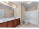 Bathroom featuring double sink vanity, toilet, and shower with tub at 871 Windsor Creek Dr, Grayson, GA 30017