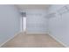Carpeted bedroom featuring wire shelving, light blue walls, and a nearby doorway at 871 Windsor Creek Dr, Grayson, GA 30017