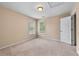 Bedroom featuring two windows, overhead lighting, and neutral carpet at 871 Windsor Creek Dr, Grayson, GA 30017