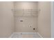 Walk-in closet with white wire shelving unit and electrical and cable hookups at 871 Windsor Creek Dr, Grayson, GA 30017