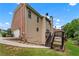 The home's exterior features mixed siding, a deck with stairs, and a garage at 871 Windsor Creek Dr, Grayson, GA 30017