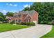 Spacious home featuring an expansive driveway and well-maintained yard at 871 Windsor Creek Dr, Grayson, GA 30017