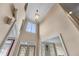 Two-story foyer featuring a chandelier and decorative wall paneling at 871 Windsor Creek Dr, Grayson, GA 30017