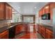 Stylish kitchen featuring wood floors, wooden cabinets, granite countertops and stainless appliances at 871 Windsor Creek Dr, Grayson, GA 30017