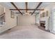Spacious living room boasts a fireplace, ceiling fan, and coffered ceiling with wooden beams at 871 Windsor Creek Dr, Grayson, GA 30017