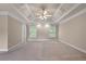 Spacious bedroom featuring a tray ceiling, ceiling fan and double windows that provides ample natural light at 871 Windsor Creek Dr, Grayson, GA 30017