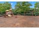 Community playground featuring a swing set, climbing dome, slide, and playhouse at 871 Windsor Creek Dr, Grayson, GA 30017