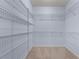 Spacious walk-in closet offers ample storage with wire shelving and neutral carpeting at 871 Windsor Creek Dr, Grayson, GA 30017