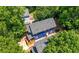 Bird's eye view of the blue home nestled among lush green trees at 1454 Rome Nw Dr, Atlanta, GA 30314