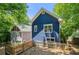 Backyard view of blue house with wooden fence and gray neighbor house at 1454 Rome Nw Dr, Atlanta, GA 30314