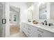 Beautiful bathroom with double vanity, marble countertop, and a view into the main bedroom at 1454 Rome Nw Dr, Atlanta, GA 30314