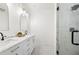 Stylish bathroom showcasing double vanity with marble countertop and a glass-enclosed shower at 1454 Rome Nw Dr, Atlanta, GA 30314