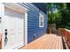 Charming blue home featuring a wooden porch and a bright white front door at 1454 Rome Nw Dr, Atlanta, GA 30314