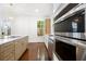 Stainless steel appliances with a view of the kitchen island, cabinetry, and natural light at 1454 Rome Nw Dr, Atlanta, GA 30314