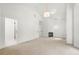 Bright main bedroom with a fireplace, neutral carpet, and access to the en suite bathroom at 1454 Rome Nw Dr, Atlanta, GA 30314