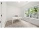 Bright home office features a desk, natural light and neutral carpet at 1454 Rome Nw Dr, Atlanta, GA 30314