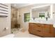 Contemporary bathroom with a walk-in shower, modern fixtures, and a sleek floating double vanity and sinks at 2469 River Oak Dr, Decatur, GA 30033