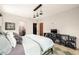 Spacious bedroom featuring a black metal bed frame and built in shelves for decor and television at 2469 River Oak Dr, Decatur, GA 30033