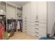 Spacious walk-in closet with custom shelving, drawers, and ample hanging space for clothing and storage at 2469 River Oak Dr, Decatur, GA 30033