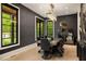 Modern dining room with unique lighting, black accent wall, and stylish decor at 2469 River Oak Dr, Decatur, GA 30033