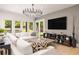 Inviting living room with French doors, ample seating, stylish decor, and a neutral color palette at 2469 River Oak Dr, Decatur, GA 30033