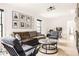 Cozy living room featuring neutral walls, comfortable seating, and a gallery wall of photos at 2469 River Oak Dr, Decatur, GA 30033
