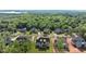 An aerial showcases a neighborhood with newly constructed homes nestled in a wooded area at 6750 Pannell Rd, Buford, GA 30518