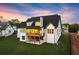 Back exterior of house featuring lawn, a deck, and an outdoor patio space at 6750 Pannell Rd, Buford, GA 30518